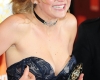 Jennifer Lawrence almost slips out of dress