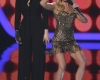 Show hosts Dennings and Behrs perform a comedy bit at the 2014 People's Choice Awards in Los Angeles